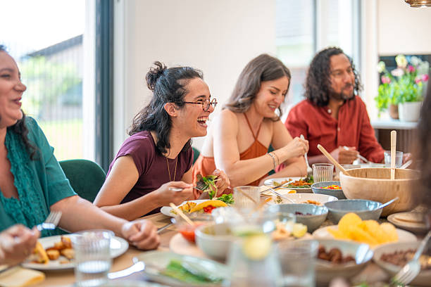 istock Multicultural Friends Sharing Laughter And Stories During Intimate Dinner Party Gathering 2226930050