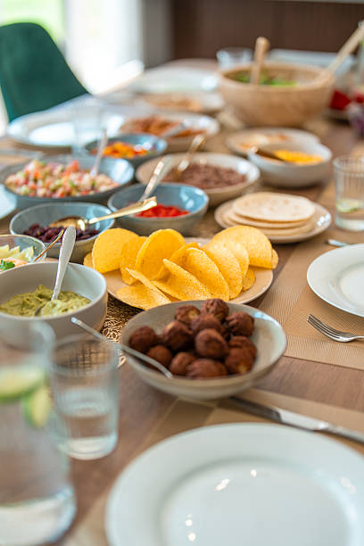istock Mexican Taco Feast Spread On Wooden Table With Fresh Ingredients And Colorful Serving Bowls 2226930077