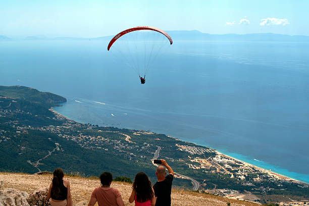 Albania, Llogara pass, July/12/2025 - Paragliding enthusiasts launch themselves from the Llogara Pass at 1000 metres above sea level towards the Ionian Sea below and the southern coast of Albania