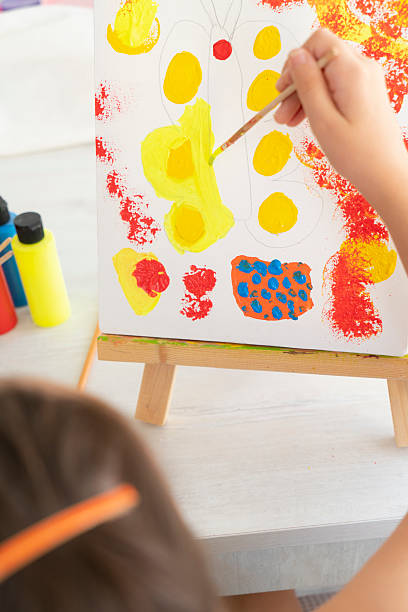 istock Young artist paints on canvas 2226933379
