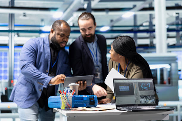 istock Factory inspectors and supervisors engaging in briefing over production metrics 2226934957