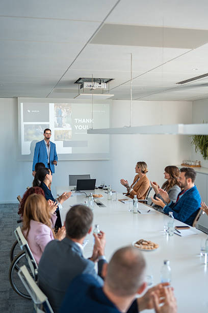 istock Diverse Business Executives in Modern Boardroom During Engaging Presentation with Bright Natural Lighting 2226935800