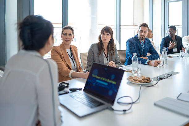 istock Diverse Business Team Collaborating In Sunlit Modern Conference Room With Laptop Presentation 2226935841