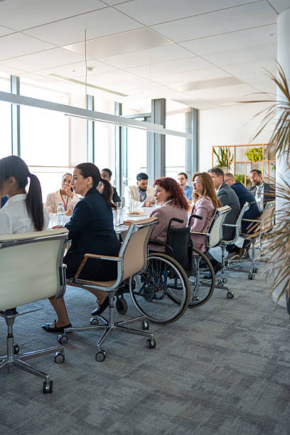 istock Diverse Business Executives Collaborating in Modern Boardroom with Bright Natural Light 2226935855