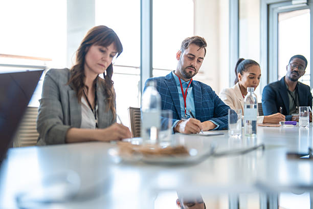 istock Diverse Business Team Taking Notes During Executive Board Meeting In Modern Office 2226936849