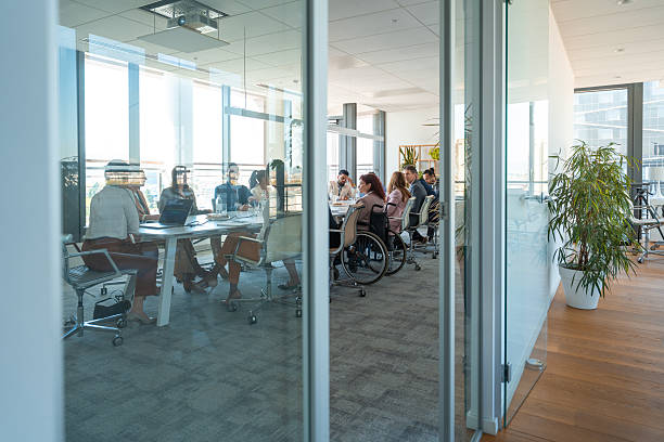 istock Diverse Business Executives Collaborating in a Modern Glass-Walled Boardroom 2226936937