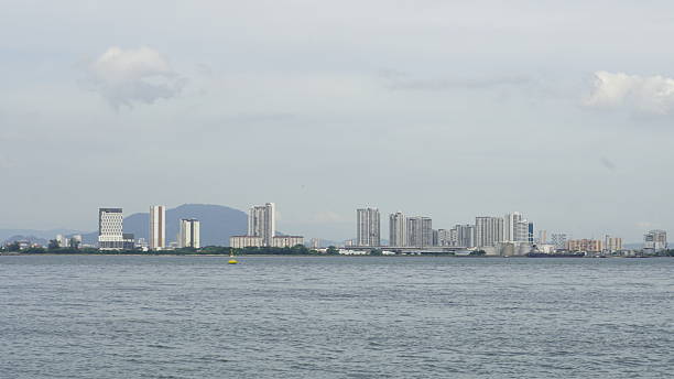 istock Coastal Skyline with Modern High-Rises and Mountain Backdrop 2226938913