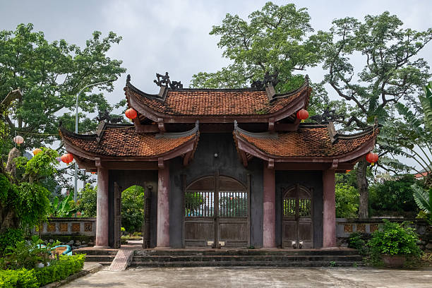 istock Traditional Vietnamese Temple Gate in Garden Setting 2226939858