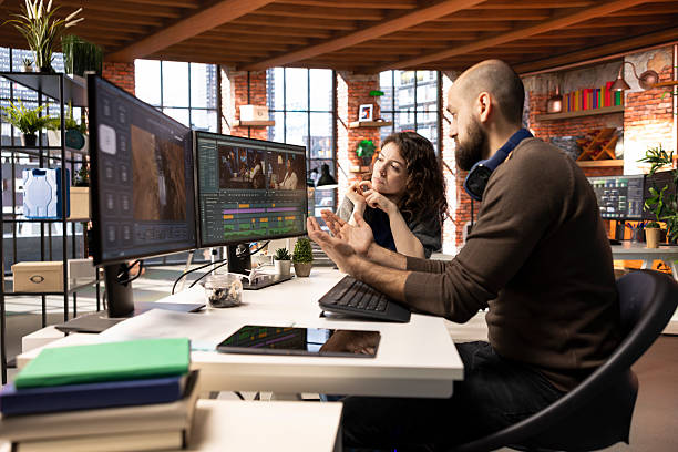 Creative team of editors collaborating on a movie montage project