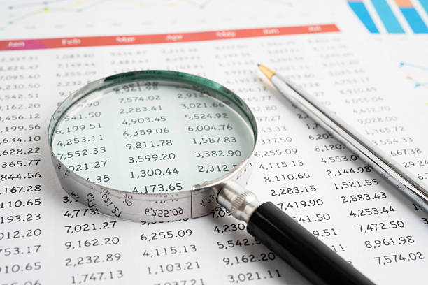 Magnifying glass on charts graphs paper. Financial development, Banking Account, Statistic, Investment Analytic research data economy.