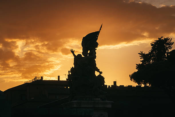 A detail of one of the four bronze statues of the winged victory on the Altare della Patria National Monument in the historic center of Rome near the Capitoline Hill (Campidoglio) and Piazza Venezia, built in 1885 in honor of the first King of Italy, Vittorio Emanuele II. Inside there is the Unknown Soldier grave, the National Memorial Monument dedicated to all Italian soldiers who died in wars. The Altare della Patria is the setting for all the official Italian celebrations, in particular the National Day of the Republic on 2 June and the Liberation Day on April 25th. Image in High Definition format.