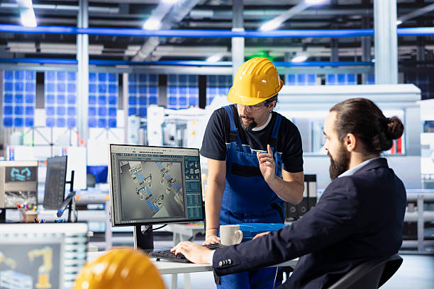 istock Engineering team using PC to monitor solar panel plant assembly lines 2226942156