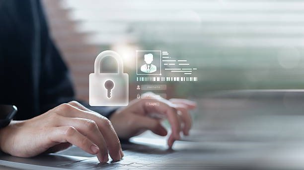 istock Hands typing on a laptop with a floating lock icon and login interface, symbolizing cybersecurity, digital privacy, and a secure authentication system. 2226952009