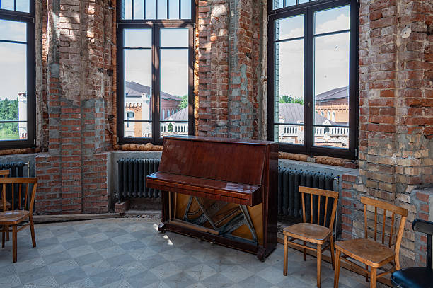 istock Old broken piano and chairs in an old abandoned interior. 2226952177