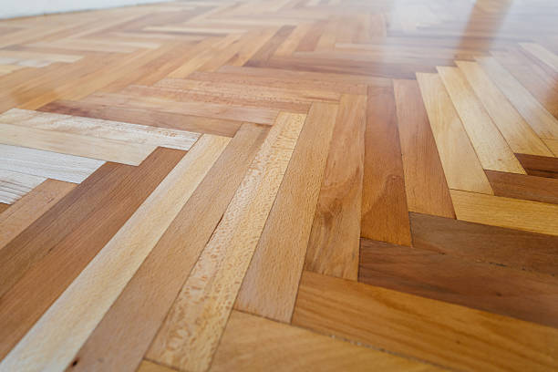 Varnished parquet floor in an empty apartment.