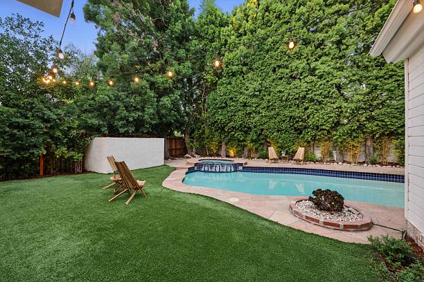 istock Storybook Traditional with Lush Backyard, Pool, Spa, and String Lights 2226954759