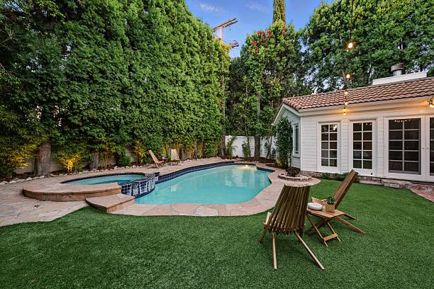istock Storybook Traditional with Lush Backyard, Pool, Spa, and String Lights 2226954773