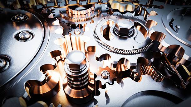 istock Close up view of interlocking metal gears rotating smoothly in complex machinery 2226955550