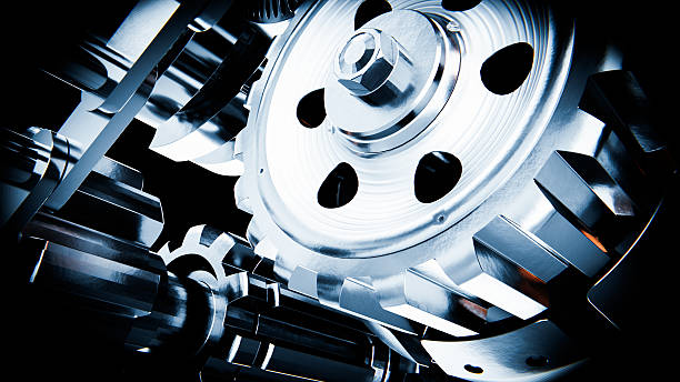 istock Close up of interlocking metal gears rotating smoothly in a complex mechanism 2226955551