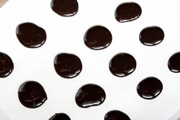 Artistic arrangement of chocolates in various shapes, perfect for advertisements or dessert-themed projects.