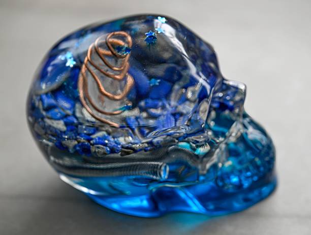 istock High resolution close up image of a single epoxy resin orgone generator skull in blue and clear colors- Israel 2226956691