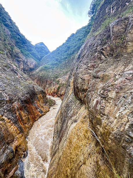 istock Narrow Rocky Canyon with Flowing River Water 2226957874