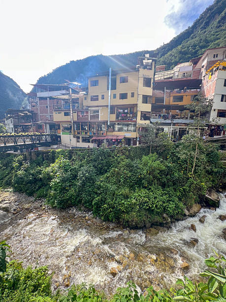istock Mountain Village with River and Pedestrian Bridge 2226959660