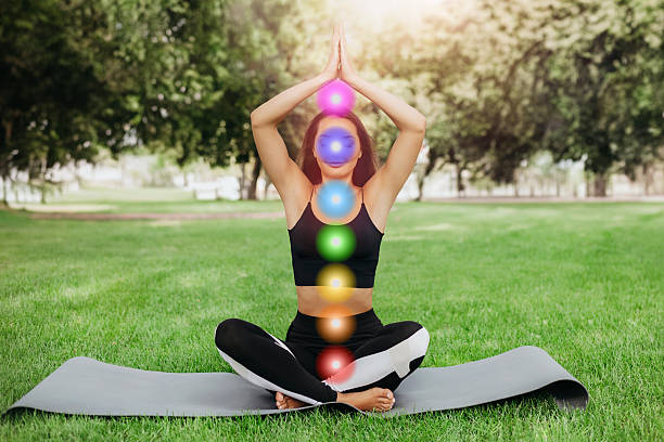 istock young woman meditating and working with chakras 2226959725