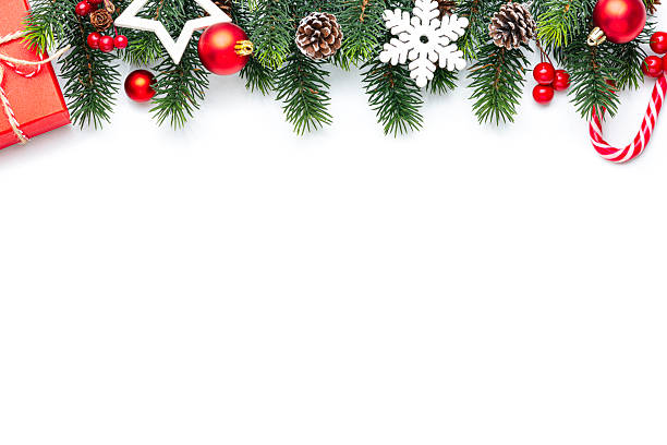 istock Christmas decoration isolated on white background. Flat lay border with copy space. Christmas ornaments, gift box, fir tree and candy cane 2226960788