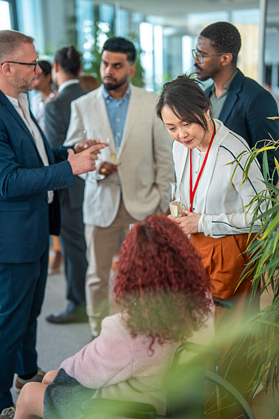 istock Group of Business Professionals Networking with Champagne in Hand 2226961146