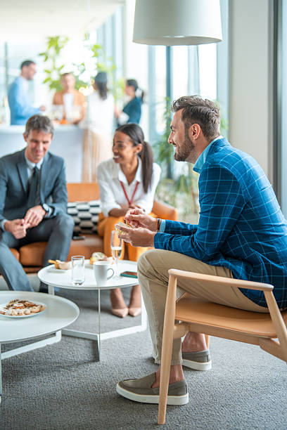 istock Diverse Group of Professionals Conversing in Modern Office Setting 2226961202