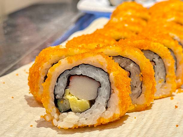 California maki or sushi rolls with salmon, cheese, caviar