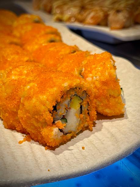 California maki or sushi rolls with salmon, cheese, caviar