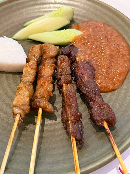 Chicken and Mutton satay sticks with gravy