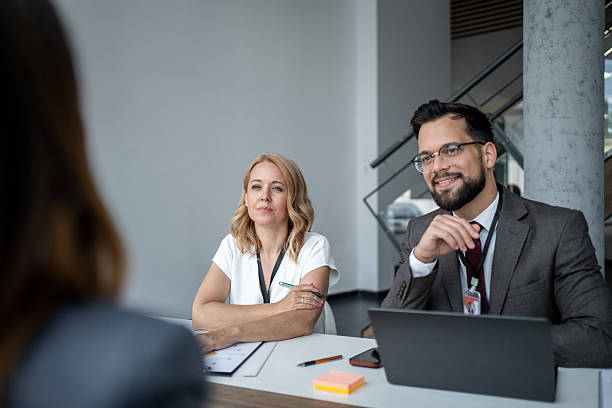 istock Interview panel listening attentively to applicant's presentation in modern office 2226963988