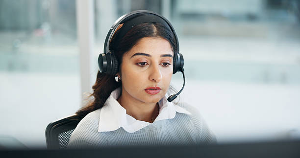 istock Computer, contact us and headset with woman in call center for assistance, feedback or virtual help. Communication, problem solving and solution with agent in office for customer service or support 2226965207