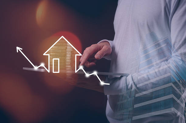 istock real estate investment concept man hand using tablet working on real estate growth graph property value new home for the family, home search, land price, property tax 2226965517