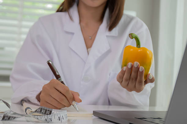 istock A female lab technician examines broccoli for scientific research in microbiology, biotechnology, and nutrition to advance health. 2226965676