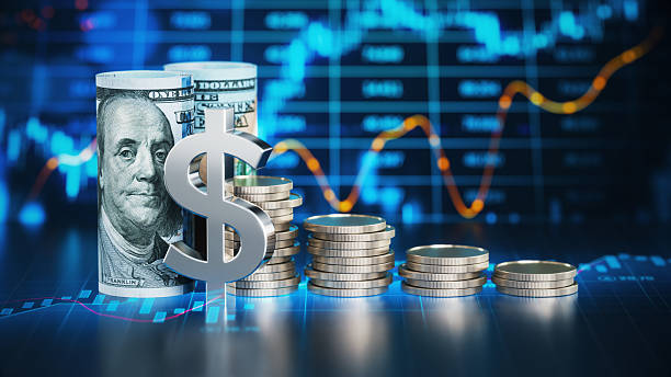istock 100 American Dollar Bills and Coins Over Financial Chart Background 2226971066