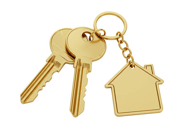istock Isolated Golden House Keys with House Shaped Keychain 2226971476