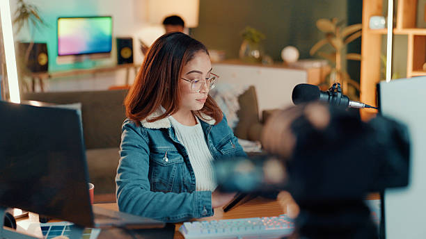 istock Content creation, camera and woman in studio, mic and communication with influencer. People, house and social media with host, talk show and radio with podcast, connection and film equipment 2226973942