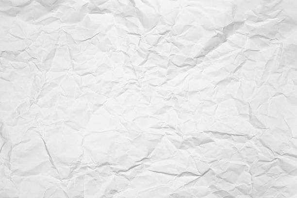 istock Soft white crumpled paper with a subtle wrinkled texture. A clean, creased abstract background or light overlay for minimalist designs. 2226975668
