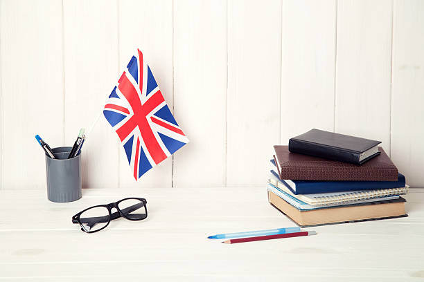 istock Great Britain flag and books on the student table. 2226976641