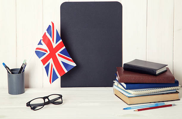 istock UK flag and books on education training class. 2226976661