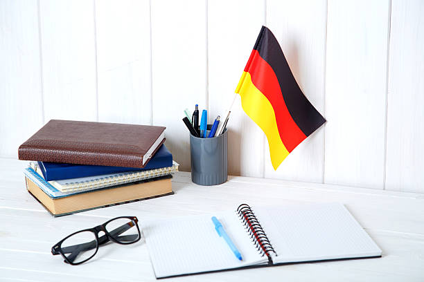 istock Germany flag and books, textbooks and eyeglasses. 2226976670