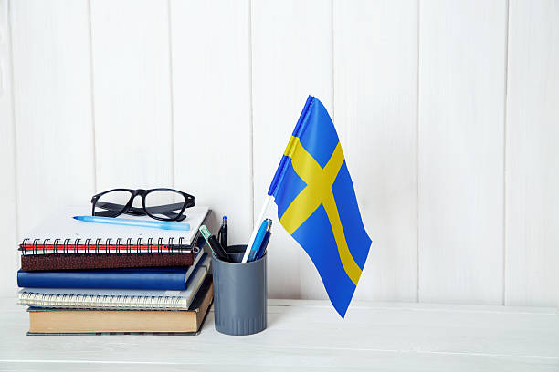 istock Education Training Class. Sweden flag and books on the student table. 2226976697