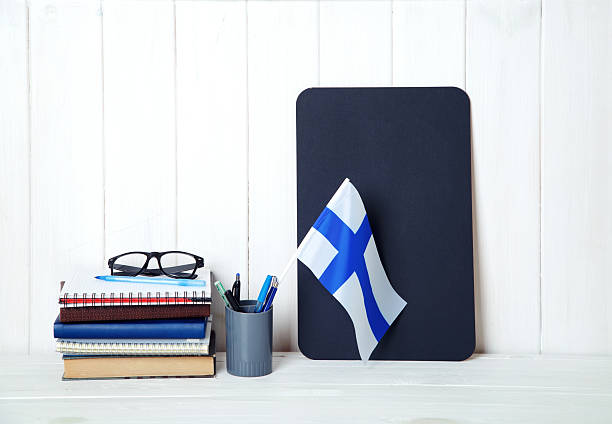 istock Education in Finland. Flag and books on the student table. 2226976729