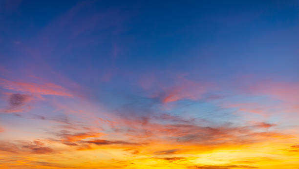 istock Colorful clouds and sky backdrop,Sunset Sky Background in the Evening with Dramatic Dusk Clouds and Colorful Pink, Orange Sunlight on Blue Twilight sky, Beautiful Summer Sunrise Horizon sky Backdrop. 2226979388
