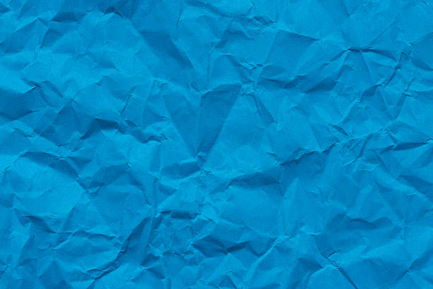 istock Blue macro crumpled paper backdrop,Crumpled blue paper texture as a background. 2226979440