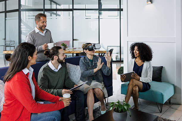 istock Group of young latin business people using virtual reality glasses during meeting testing VR headset at office in Mexico Latin America. hispanic people at working at job 2226983805